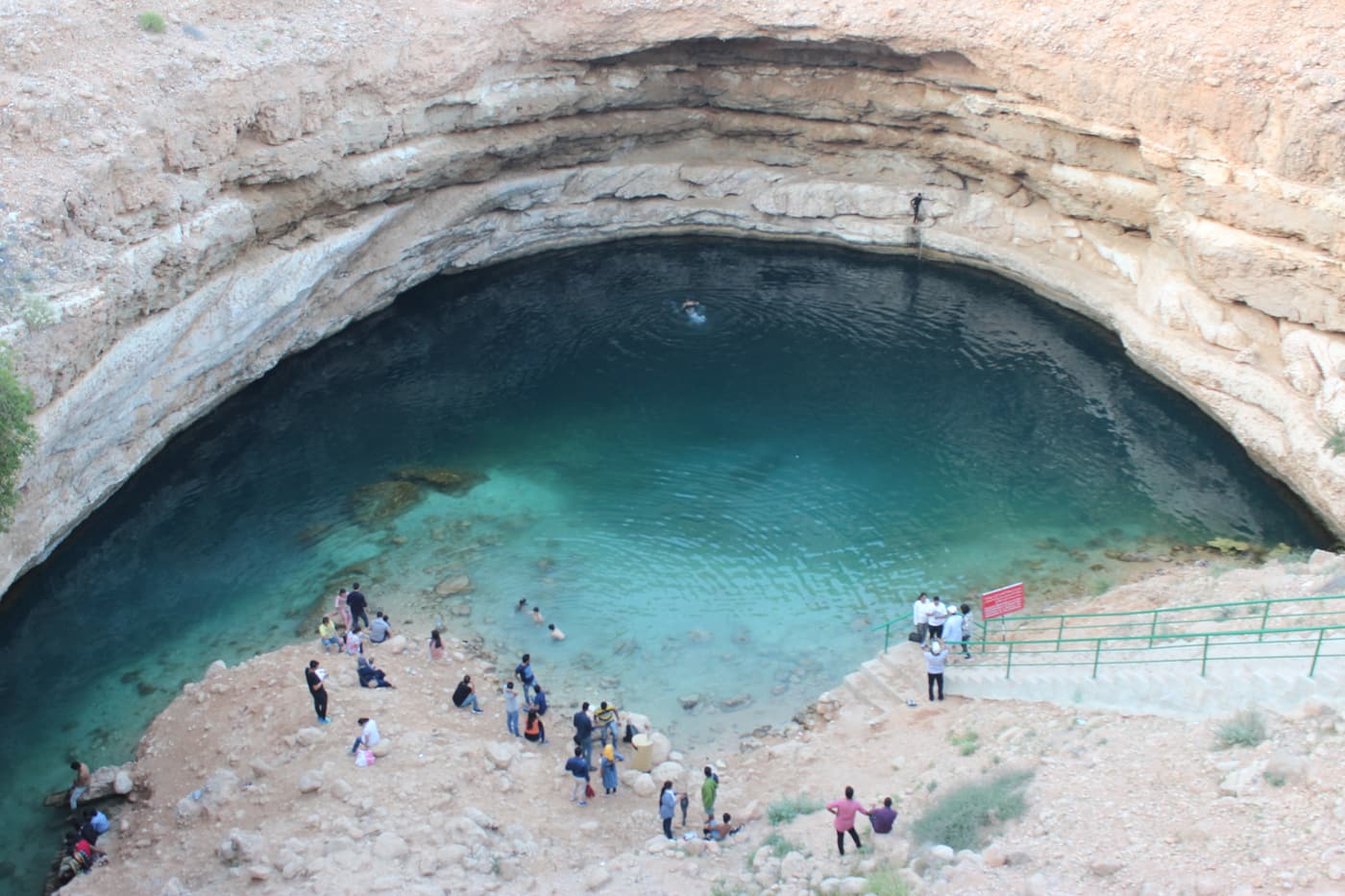 The turquoise water inside the Bimmah Sinkhole
