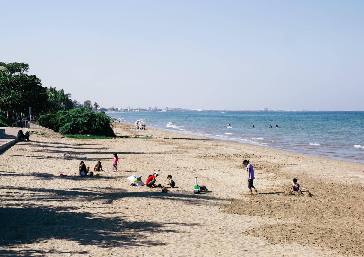 The sandy shore of Qurum Beach in Muscat