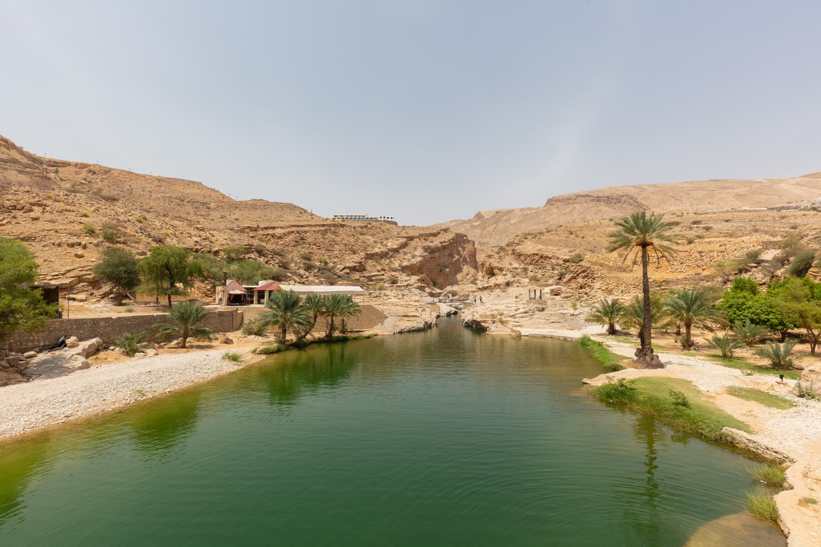Clear green pools among the rocks of Wadi Bani Khalid