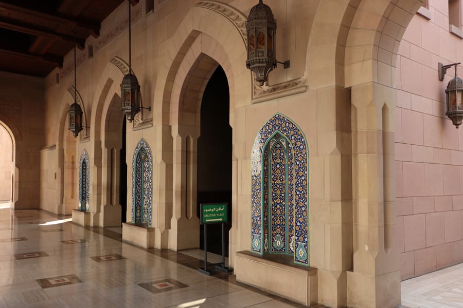 Arched arcades around the courtyard of the Sultan Qaboos Grand Mosque